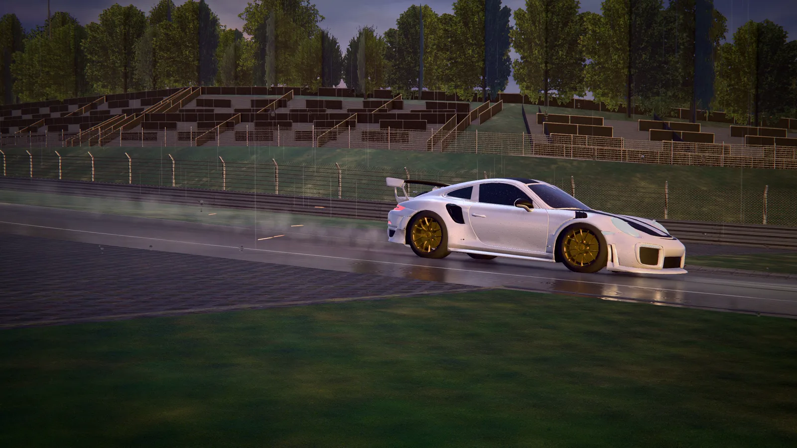A white sports car with gold wheels sliding through a corner on a wet circuit, seen from the side in front of grandstands