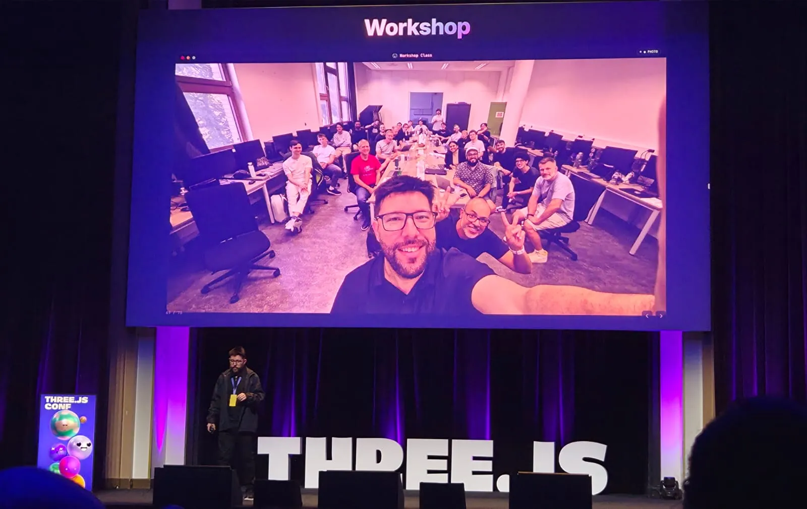 A photo of the workshop class shown on the main stage screen at the conference