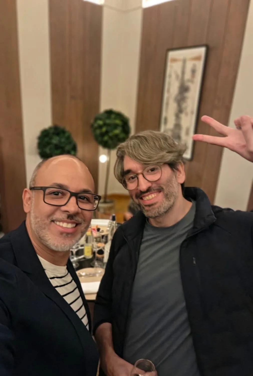 Me and Mr.doob, the creator of Three.js, smiling at a dinner table in Paris